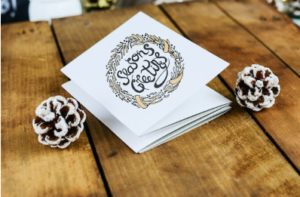 What are the benefits of sending holiday cards to customers and clients