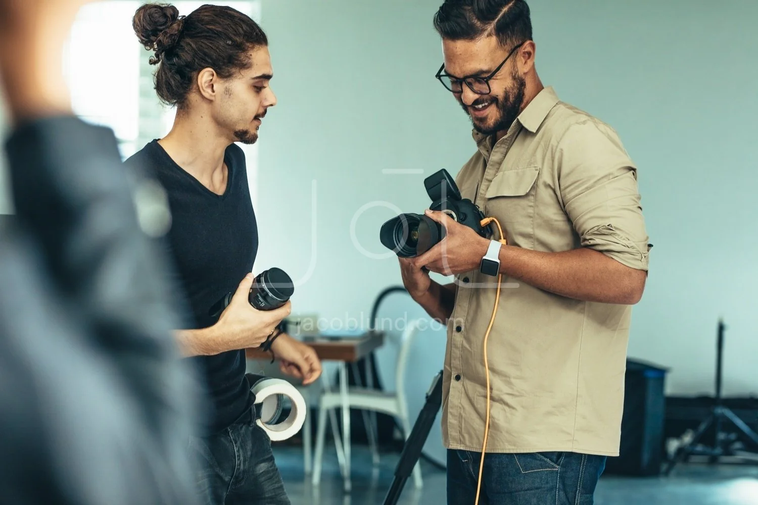 A photographer capturing a stunning landscape with a camera