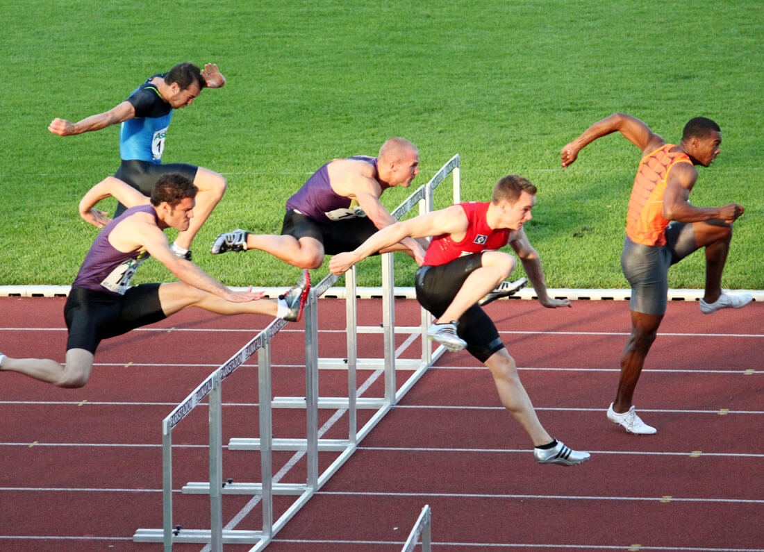 An athlete training hard on a running track