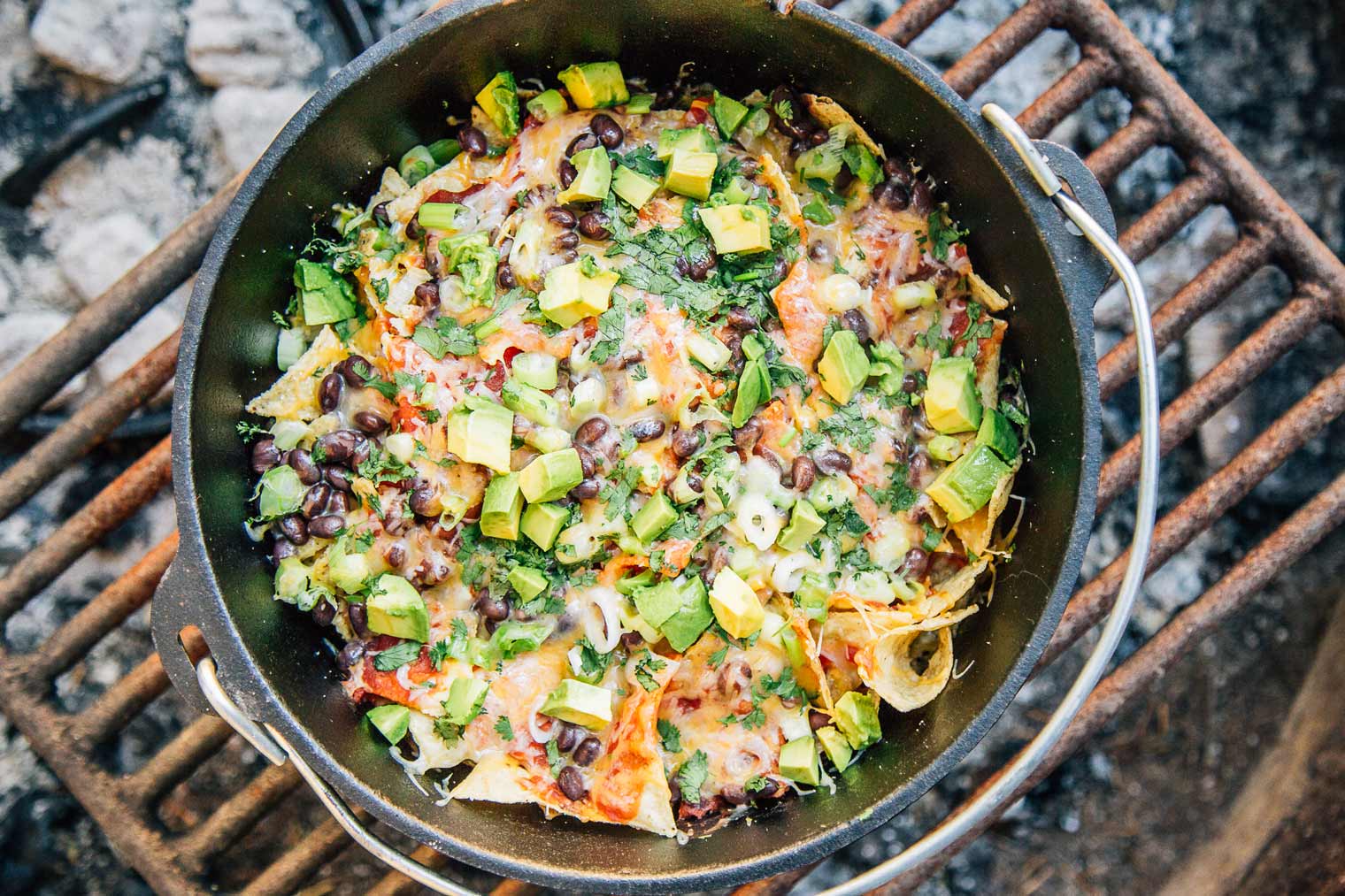 Delicious camping meal prepared over a campfire with friends